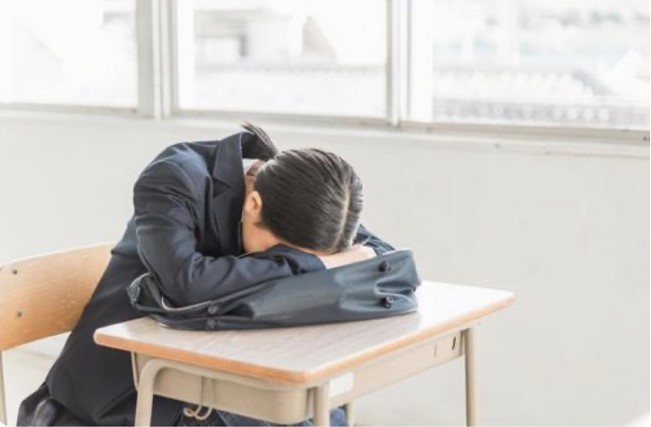 頭痛がする女子高生